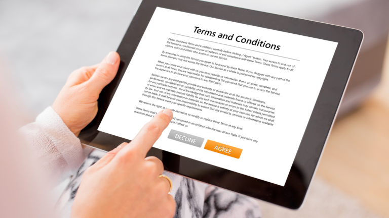 Person viewing the terms and conditions of a service on a digital device.